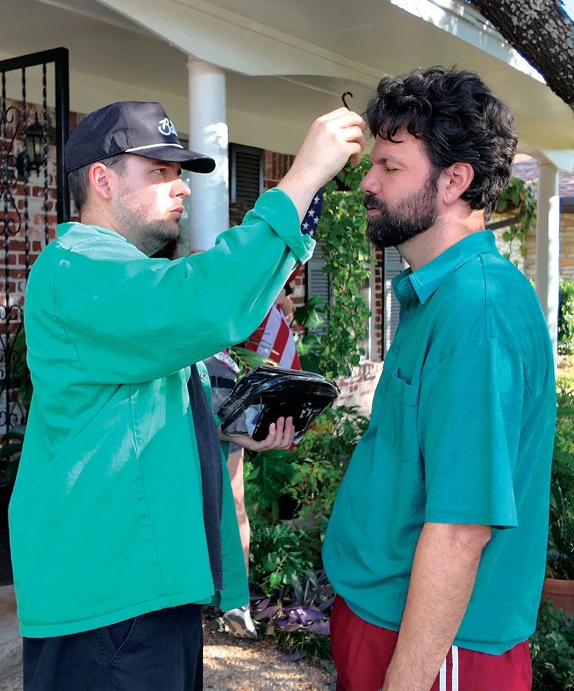 A hair check for Brian Villalobos on the front porch
